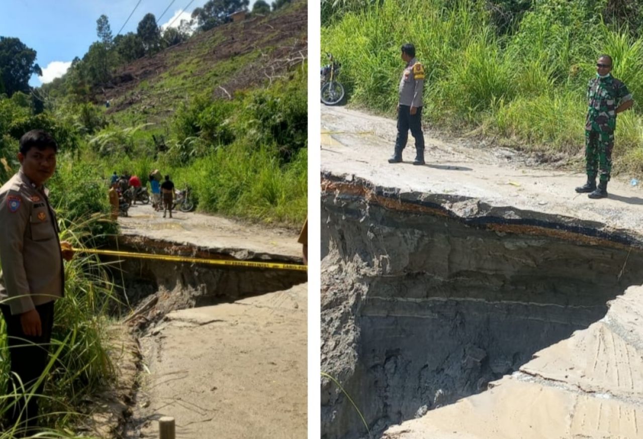 Polsek Habinsaran Pasang Police Line di Jalanan Ambles Akibat Curah Hujan Tinggi