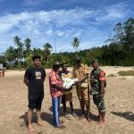 Babinsa Koramil 1710-01/Kokonao Dampingi Penyaluran Beras Ketahanan Pangan Untuk Masyarakat